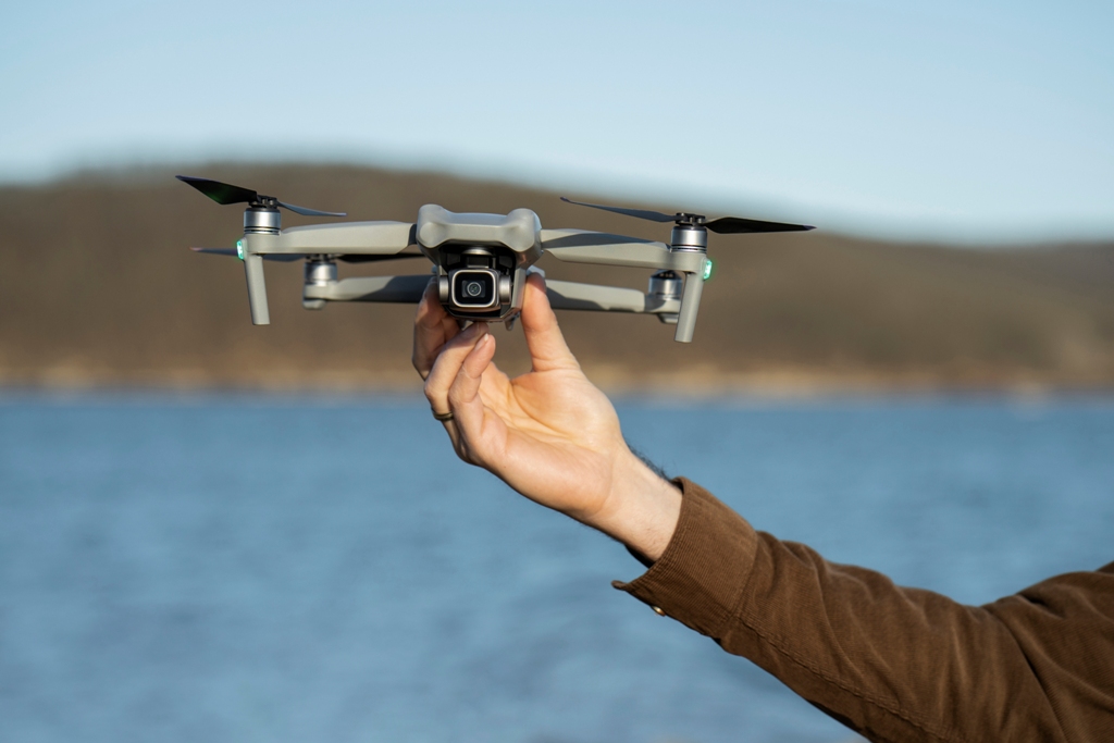 man_s_hand_holding_drone_outdoors.jpg
